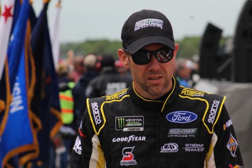Matt Kenseth walks during driver introductions for the 2018 Pocono 400. (Tyler Head | The Racing Experts)